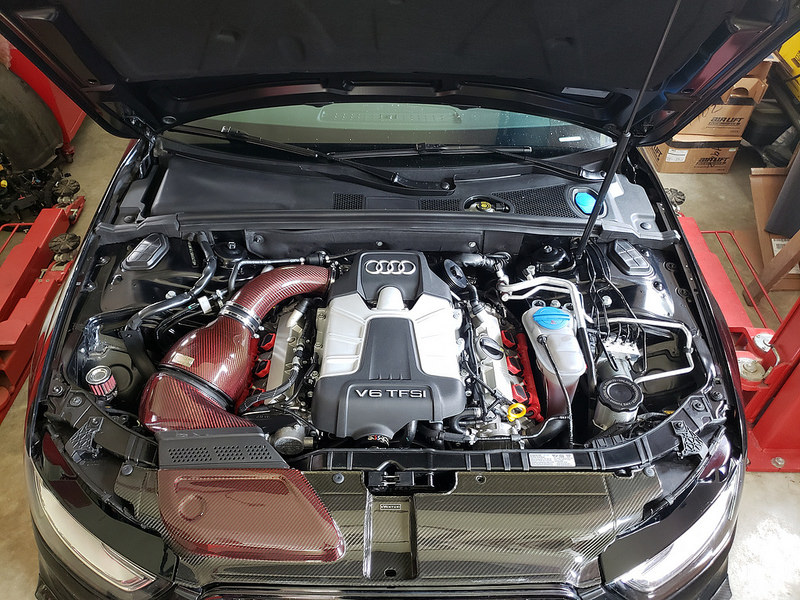 The completed engine bay, with the car’s Eventuri red kevlar intake all shined up.
